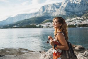 Woman Enjoying A Summer Vacation While Exploring Mediterranean Coast